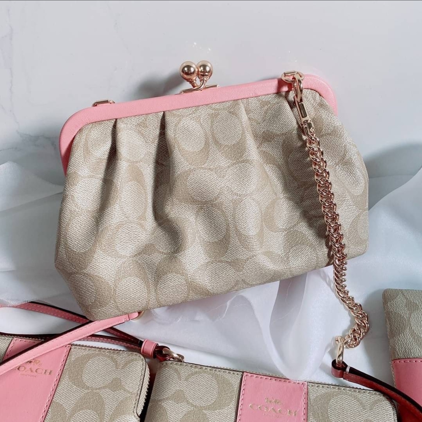 Coach pink deals clutch bag