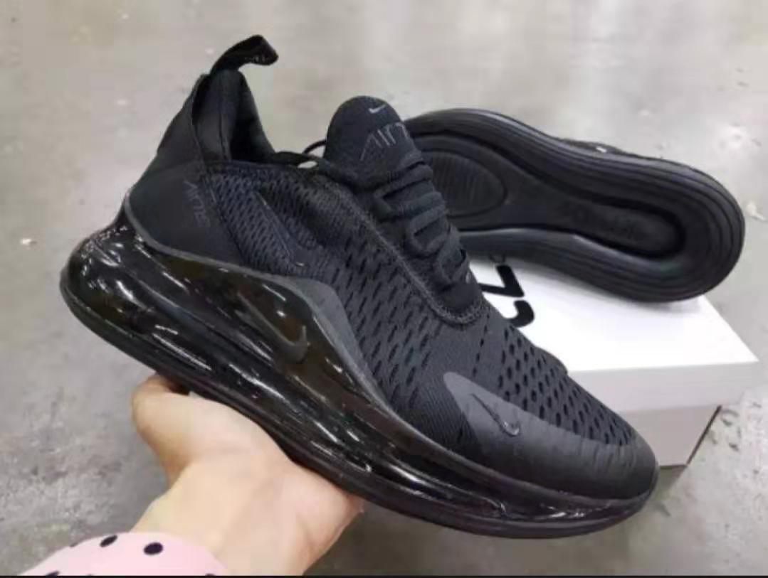 solid black running shoes