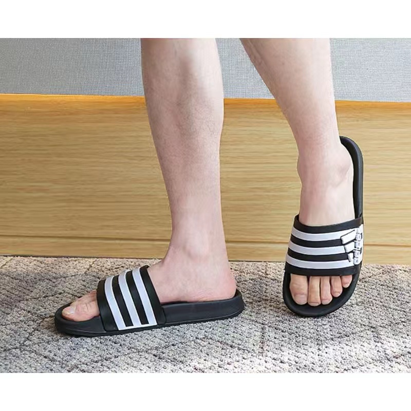 Adidas duramo outlet slides on feet