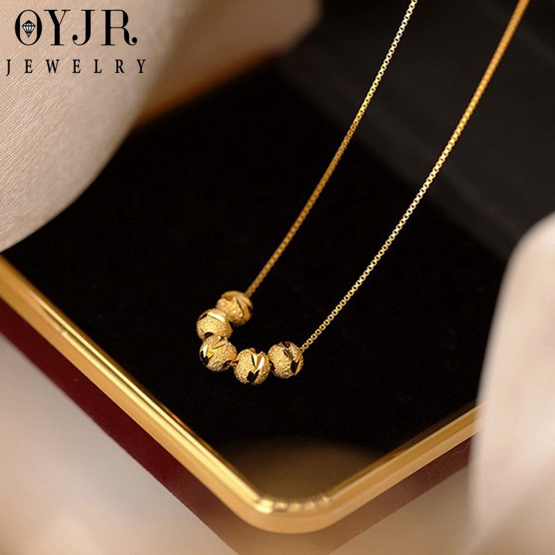 gold round ball necklace