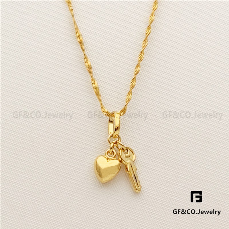 gold heart and key necklace