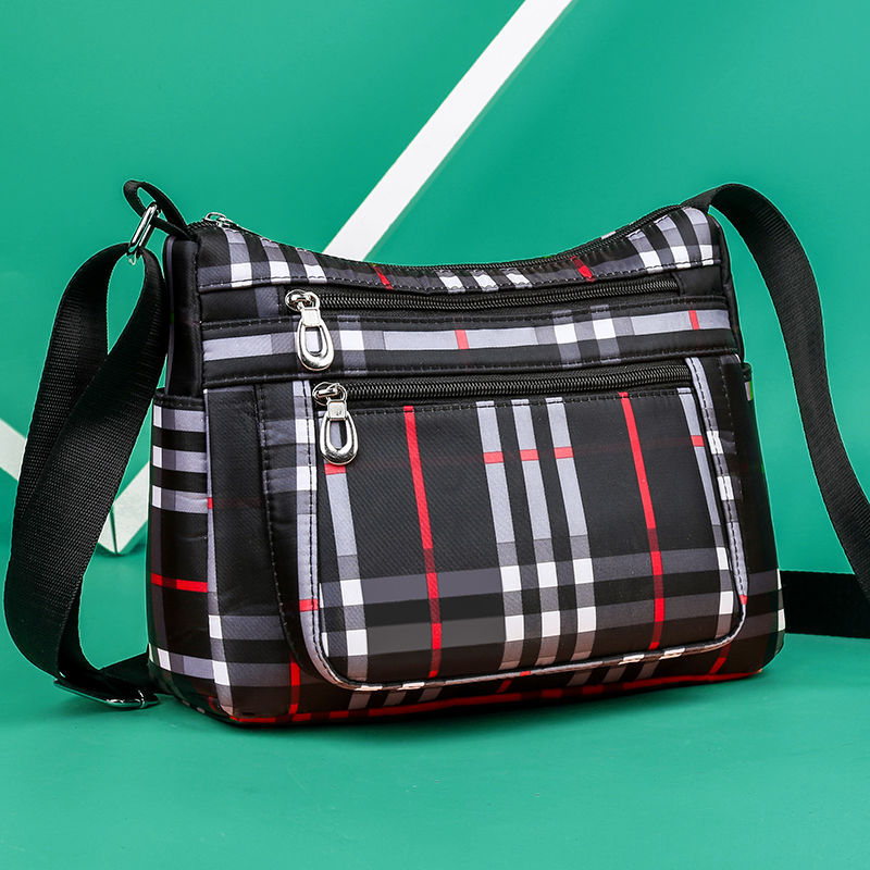 Champion tartan 2025 sling bag