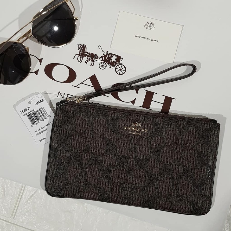 COACH LARGE WRISTLET IN SIGNATURE CANVAS (IM/BROWN/BLACK)